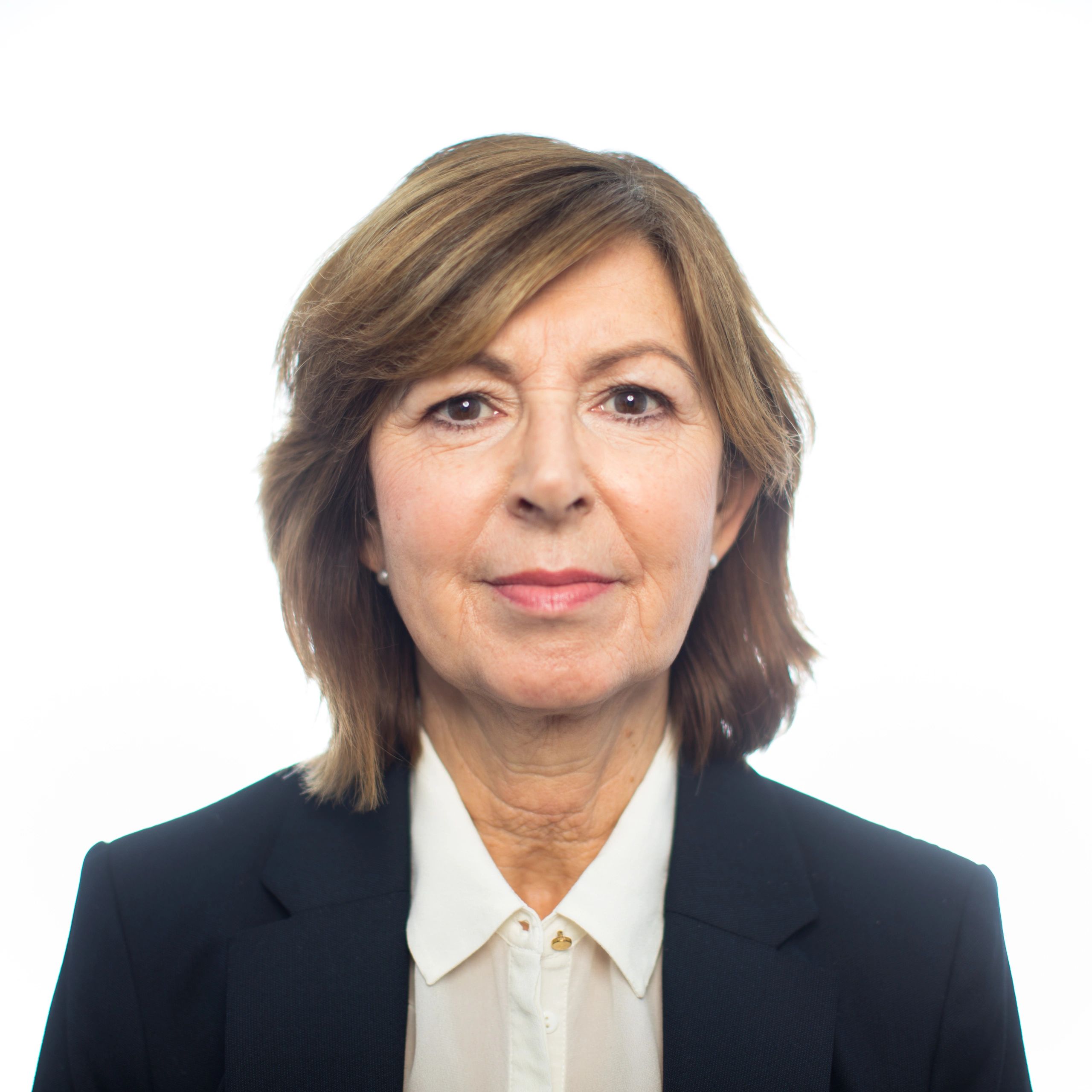 Professional headshot of a businesswoman in a white blazer