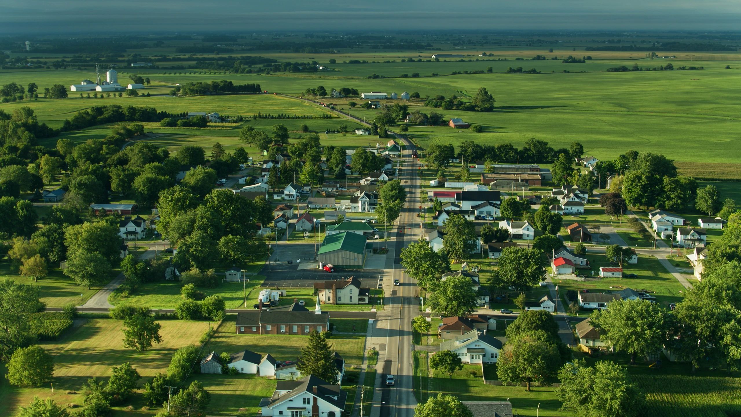 Aerial view of a small town and surrounding landscape