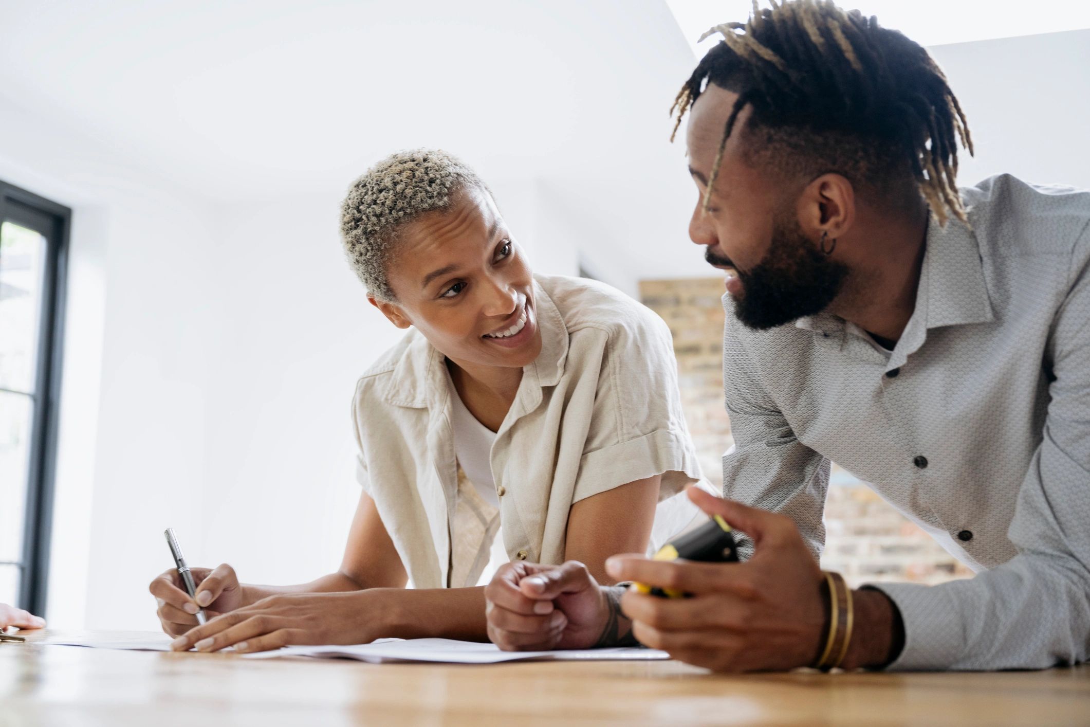 Couple reviewing home purchase paperwork