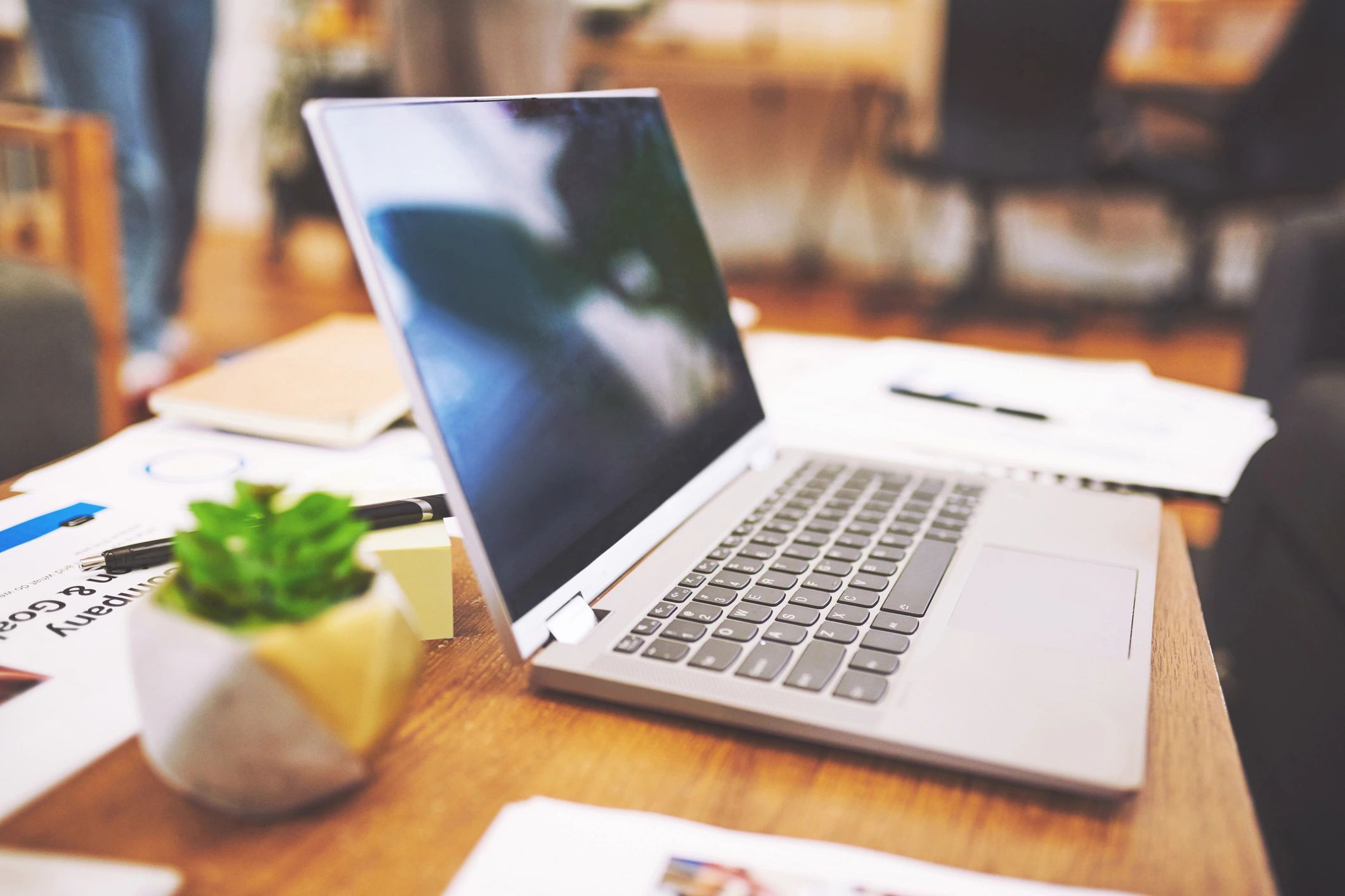 Laptop and financial documents on a desk