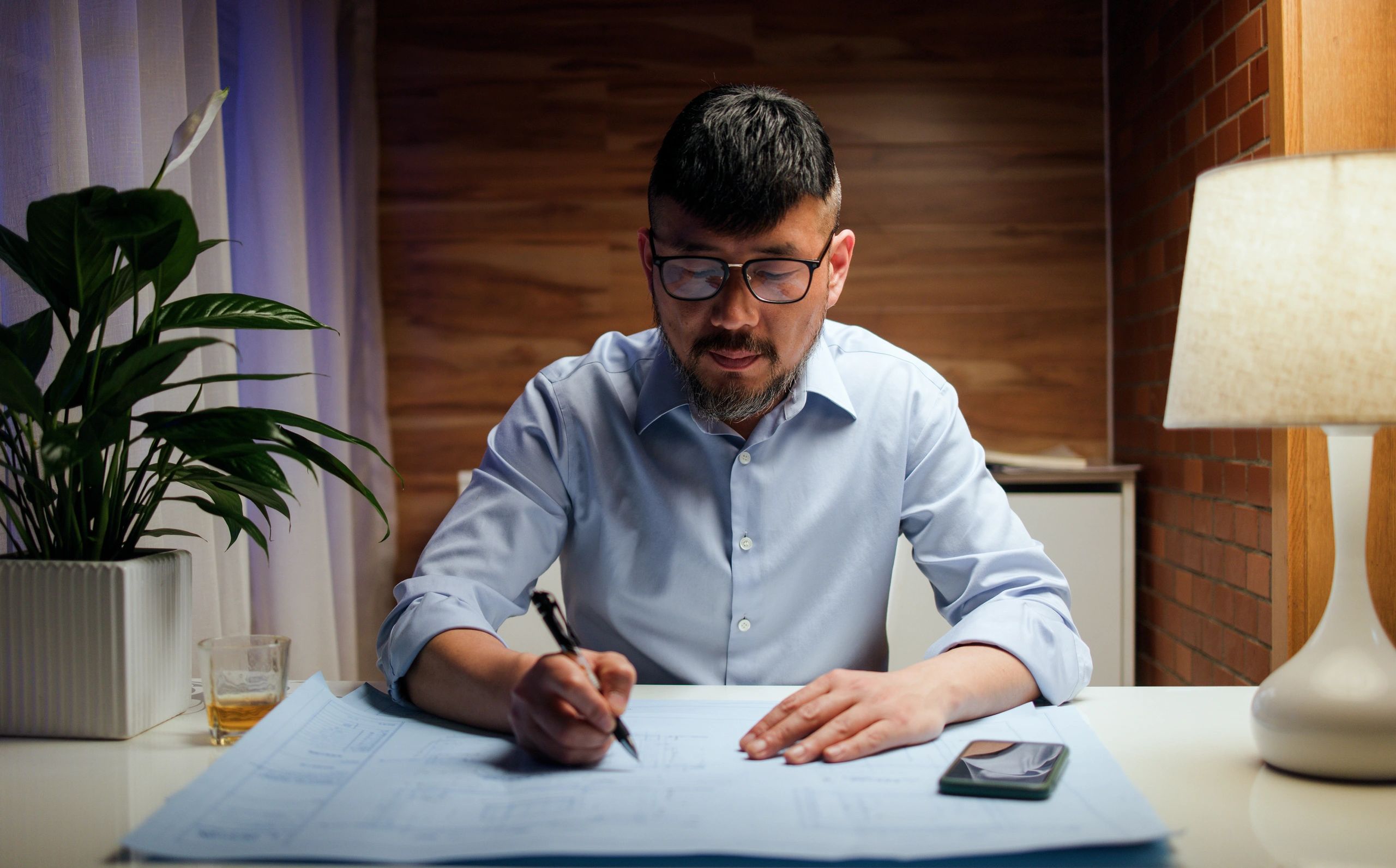 Investor reviewing documents and cash flow numbers