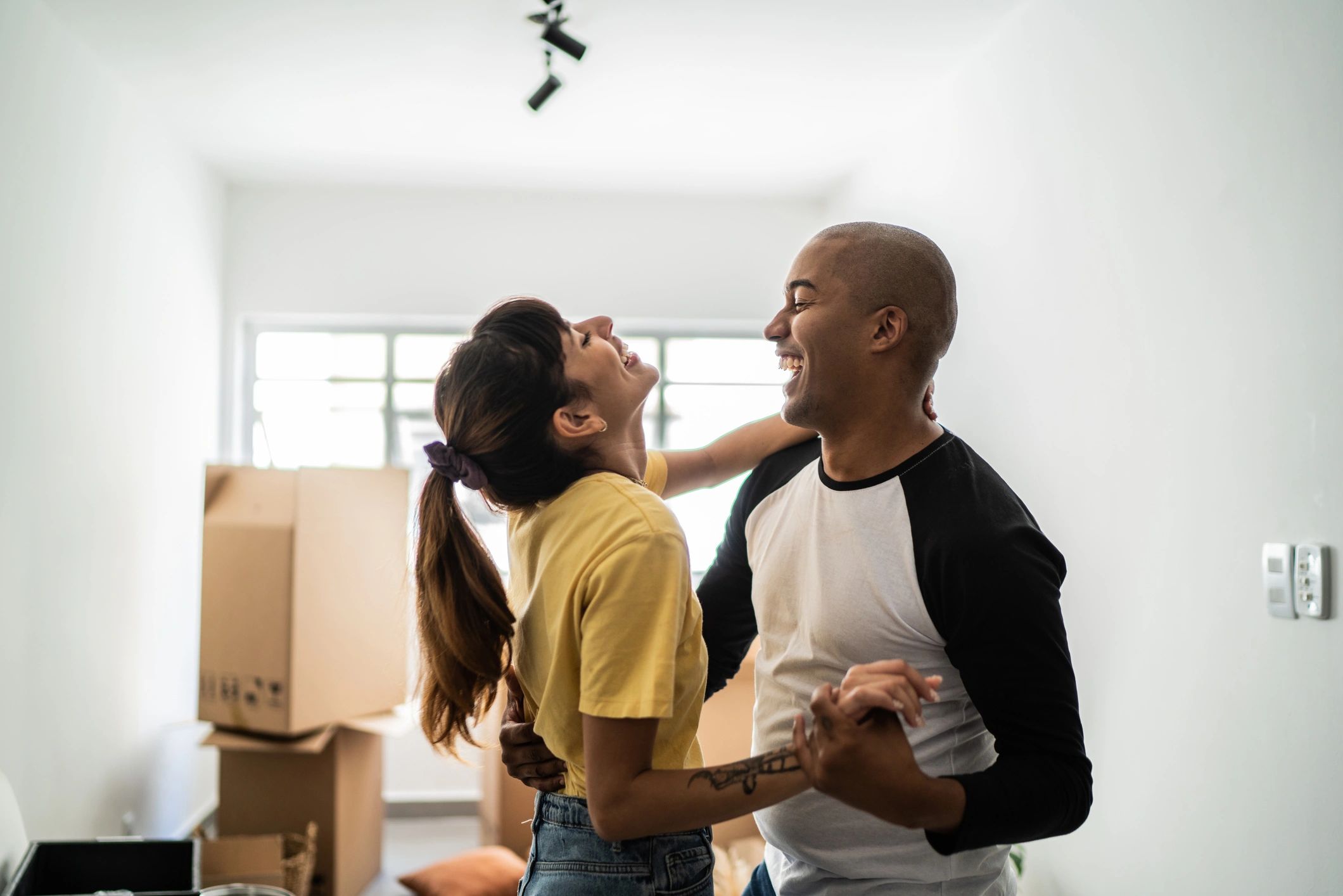Happy couple celebrating with new home keys