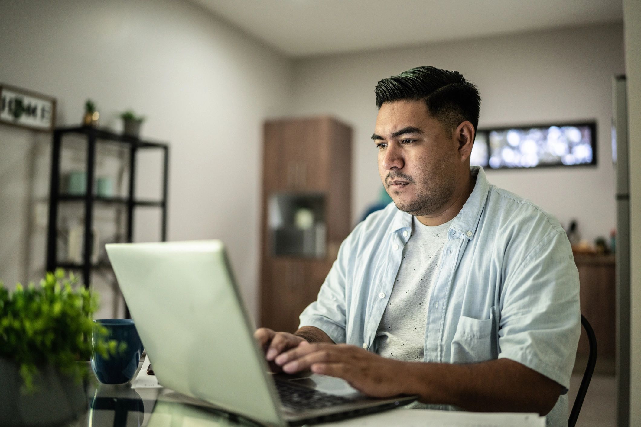 Self-employed professional working on a laptop at home
