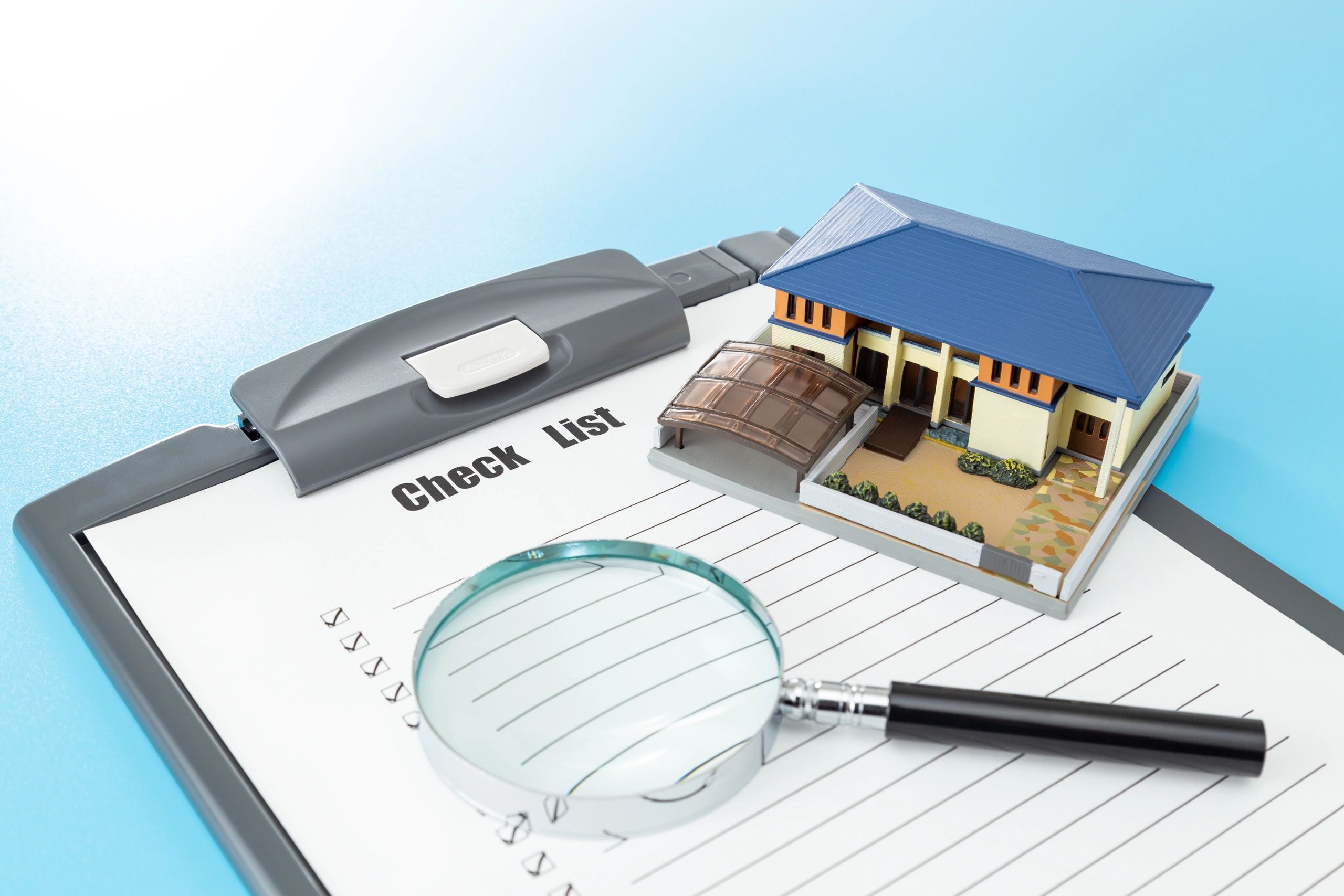 House model next to a checklist