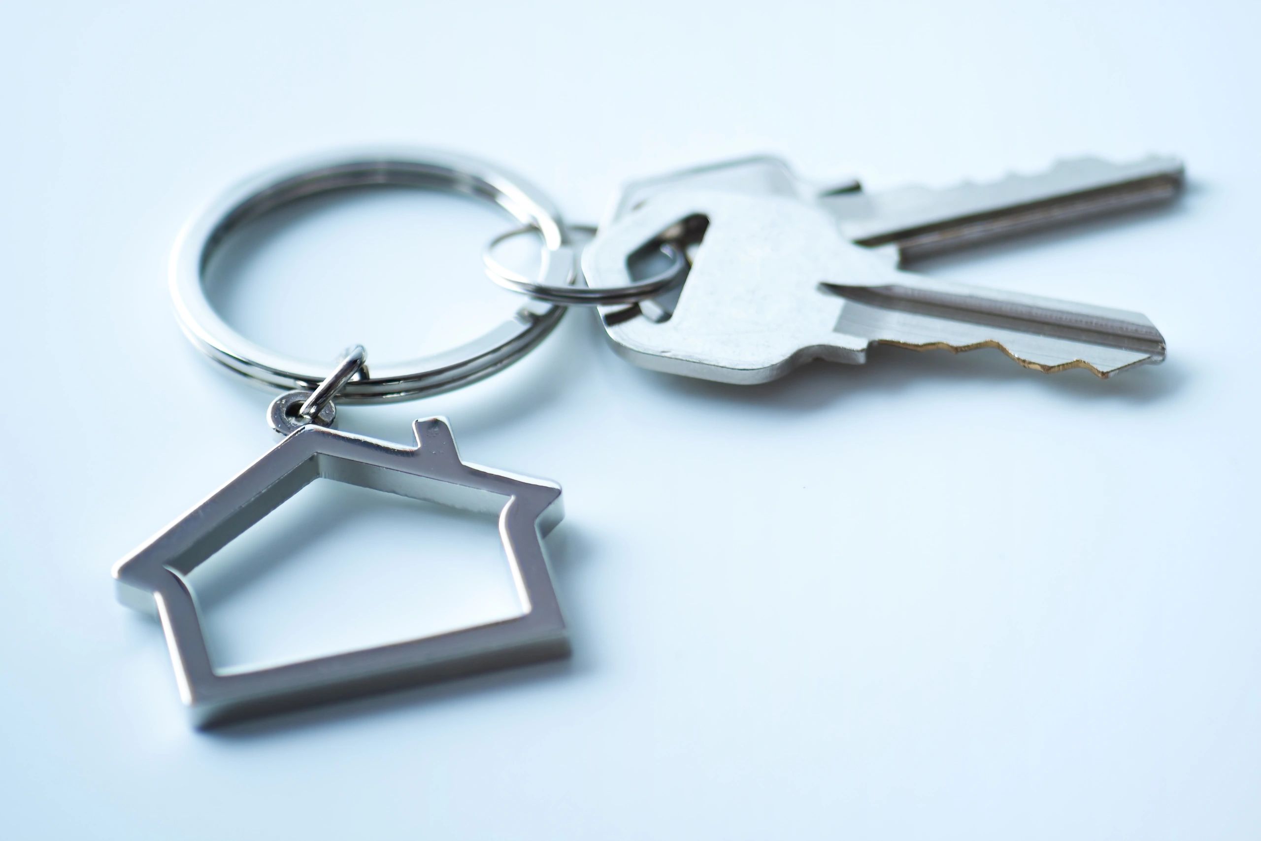 House-shaped keychain with keys