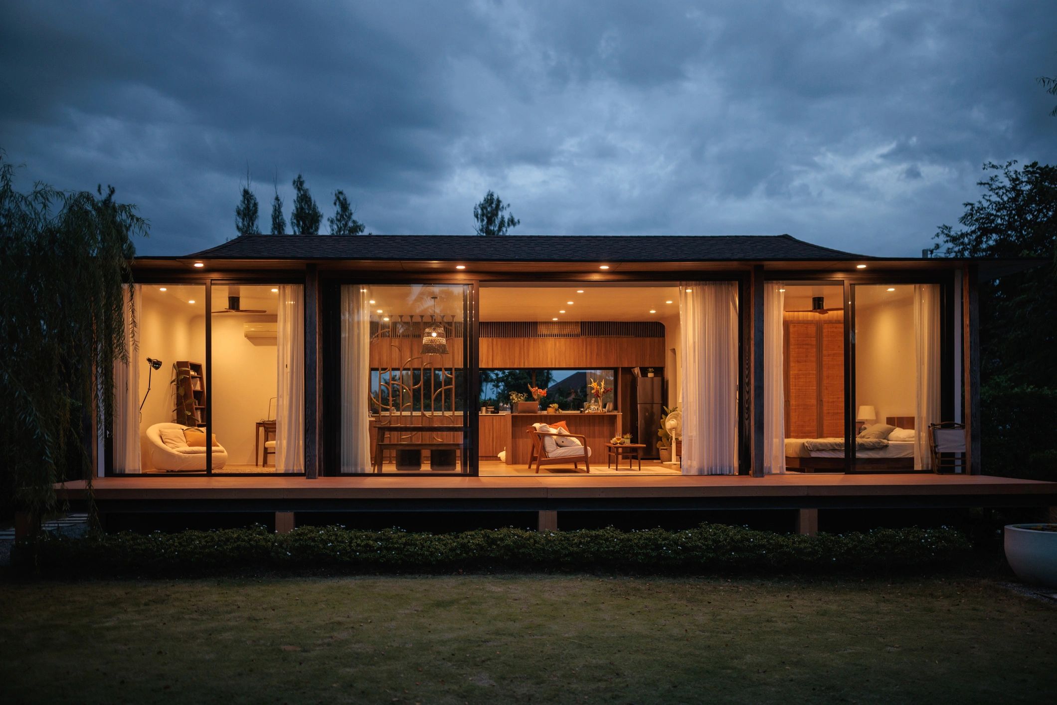 Exterior of a modern residential rental property at dusk