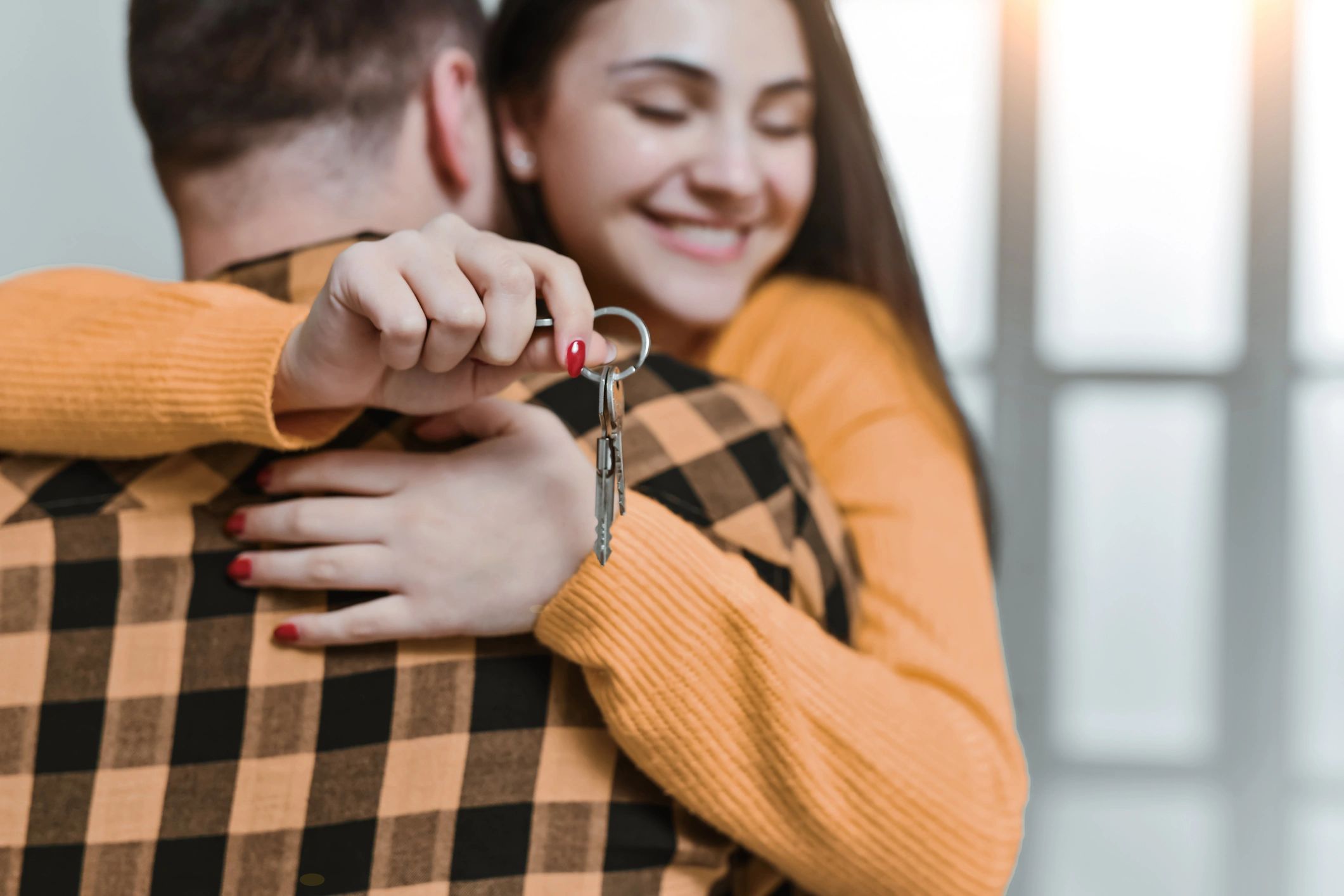 First-time buyers holding house keys