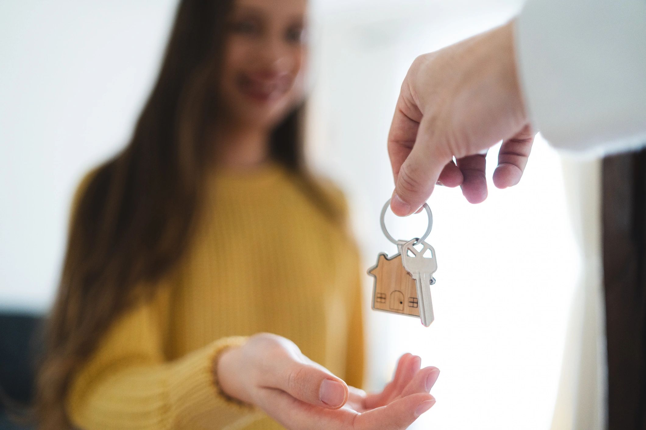Handing keys to a new homeowner
