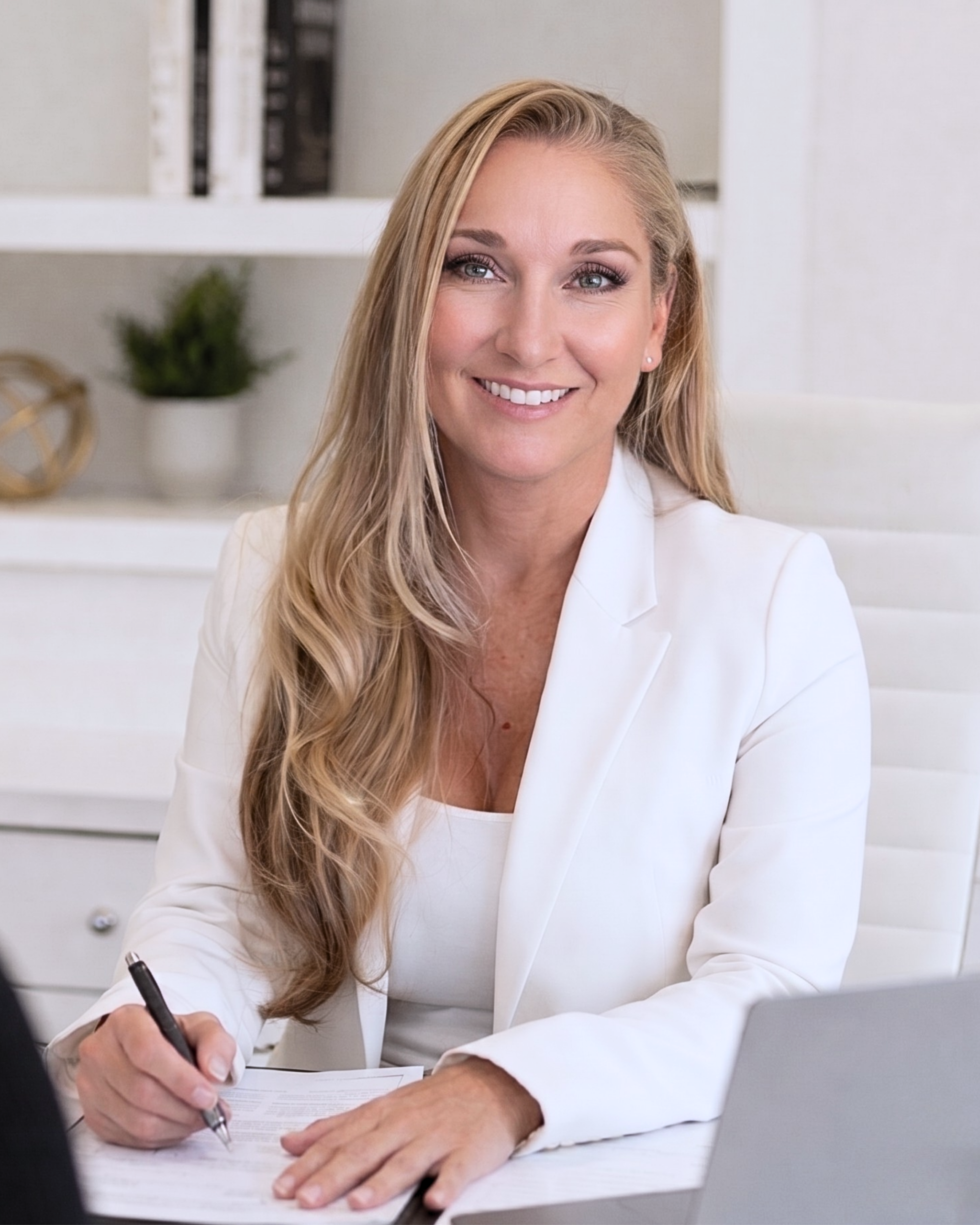 Mozelle Brick in a white suit jacket